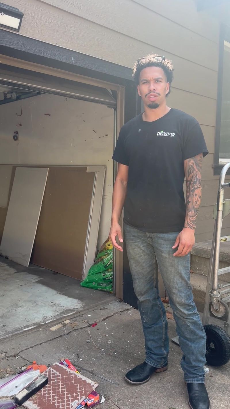 A Declutter crew member on a garage cleanout job
